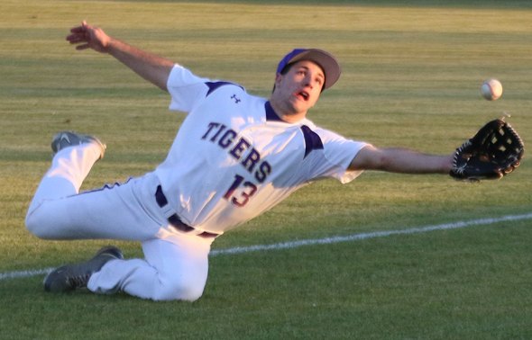 Tiger varsity baseball blows past Dinuba 10-2 Wednesday, Fowler High up next Bryce Aguilar just missed running down this pop fly. The Tigers went on to defeat Dinuba on Wednesday night 10-2.